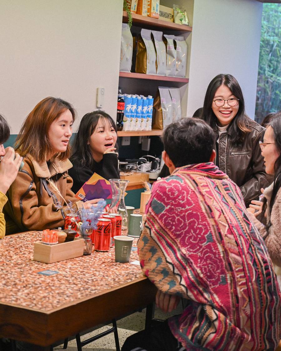 People talking around a table at a Yapify gathering