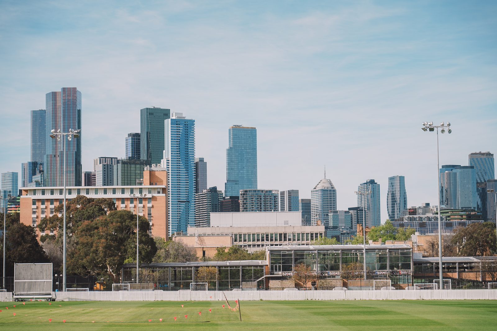 The University of Melbourne ovals and the city skyline from the Ernie Cropley Pavilion on market day