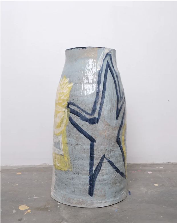 Hand-thrown ceramic vase painted in blue and yellow, titled Blu