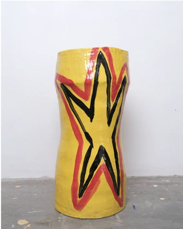 Yellow hand-thrown ceramic vase painted with a black and red star, titled Bill